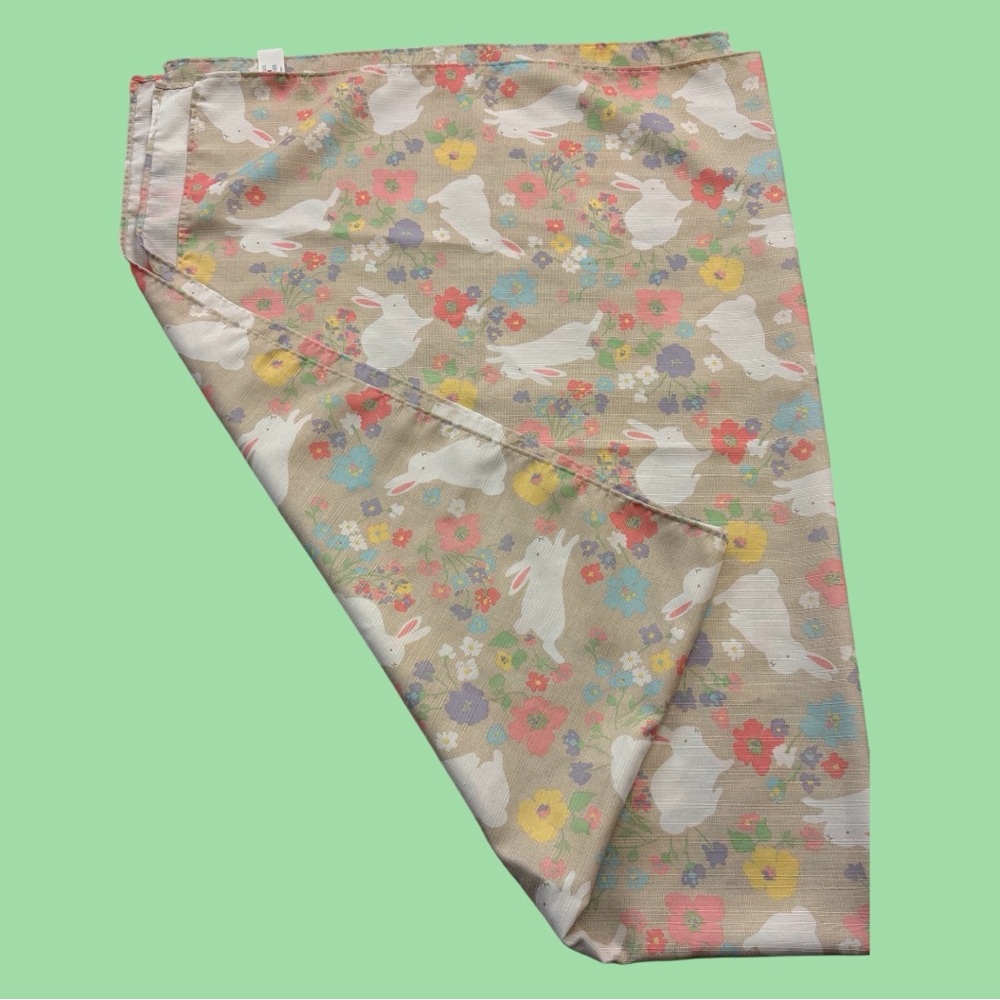 Kohls Tablecloth Easter Bunny theme appr. 80x60, pastels, neutral background.